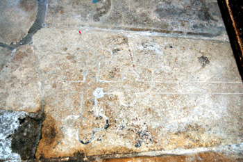 Medieval gravestone in Harrold church porch May 2008